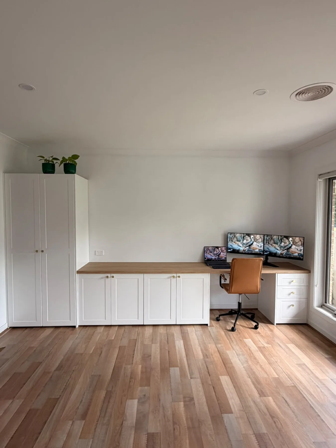 Finished bespoke cabinetry run, straight-on